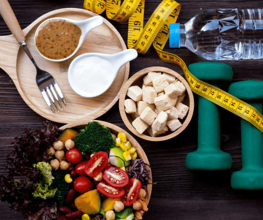Image of plant-based foods on table with weights and measuring tape surrounding them